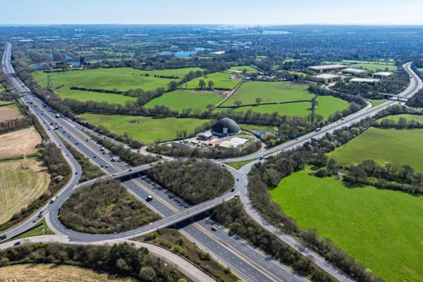 Aerial shot of motorway junction, with Panattoni T Park Southampton Aerial CGI Image in the background